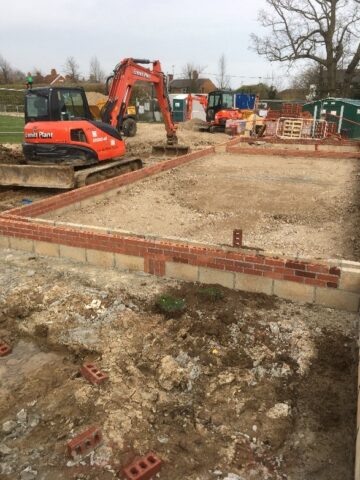 First course of bricks being laid at the site of the new Pavilion.