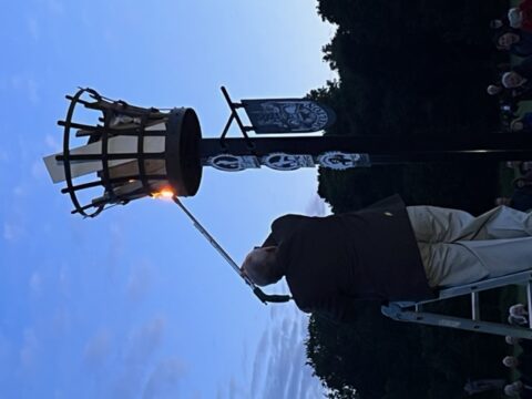 Alan lights the beacon with a gas powered weed burner